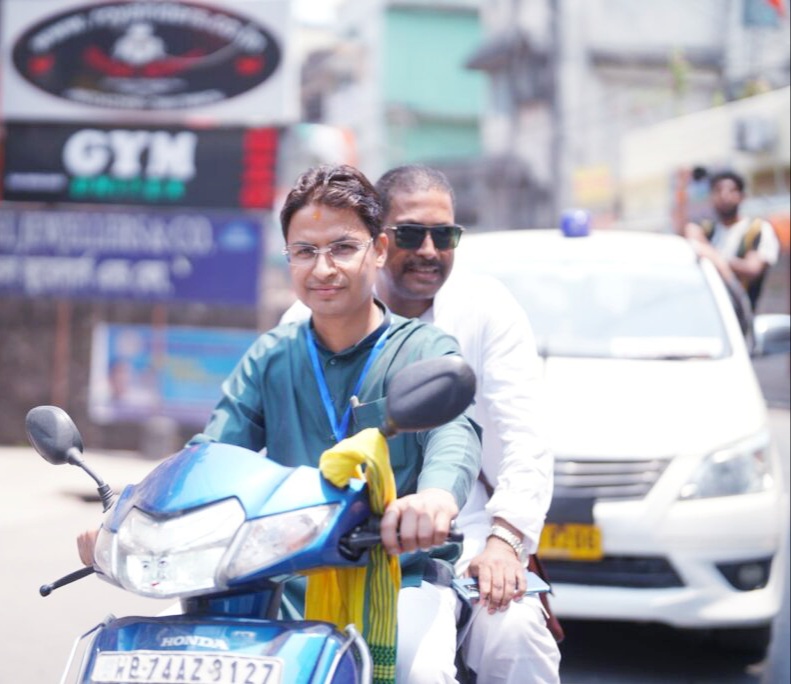 BJP candidate Raju Bista inspected polling stations on a scooty in Siliguri